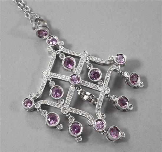 A modern 18ct white gold, diamond and pink sapphire set diamond shaped drop pendant, pendant 52mm.